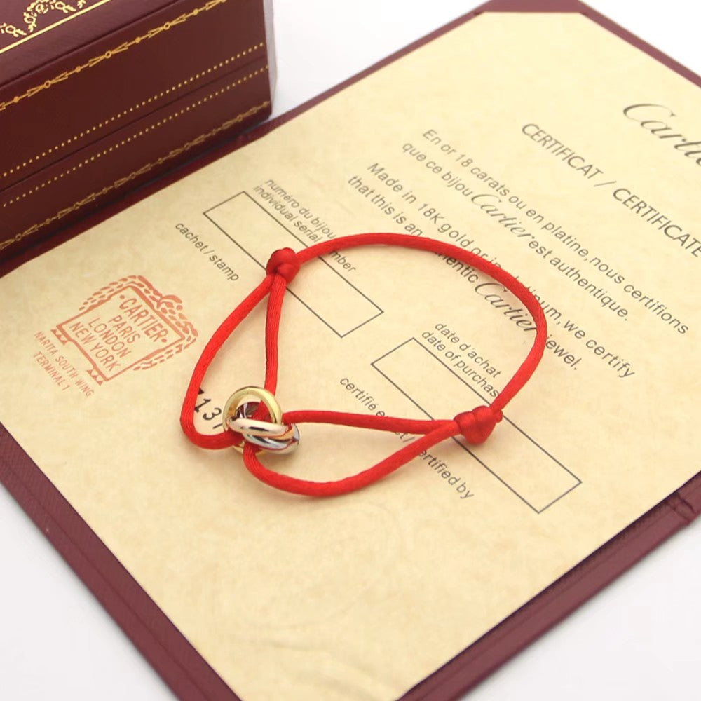 CARTIER TRINITY PINK GOLD SILVER GOLD TEXTILE BRACELET