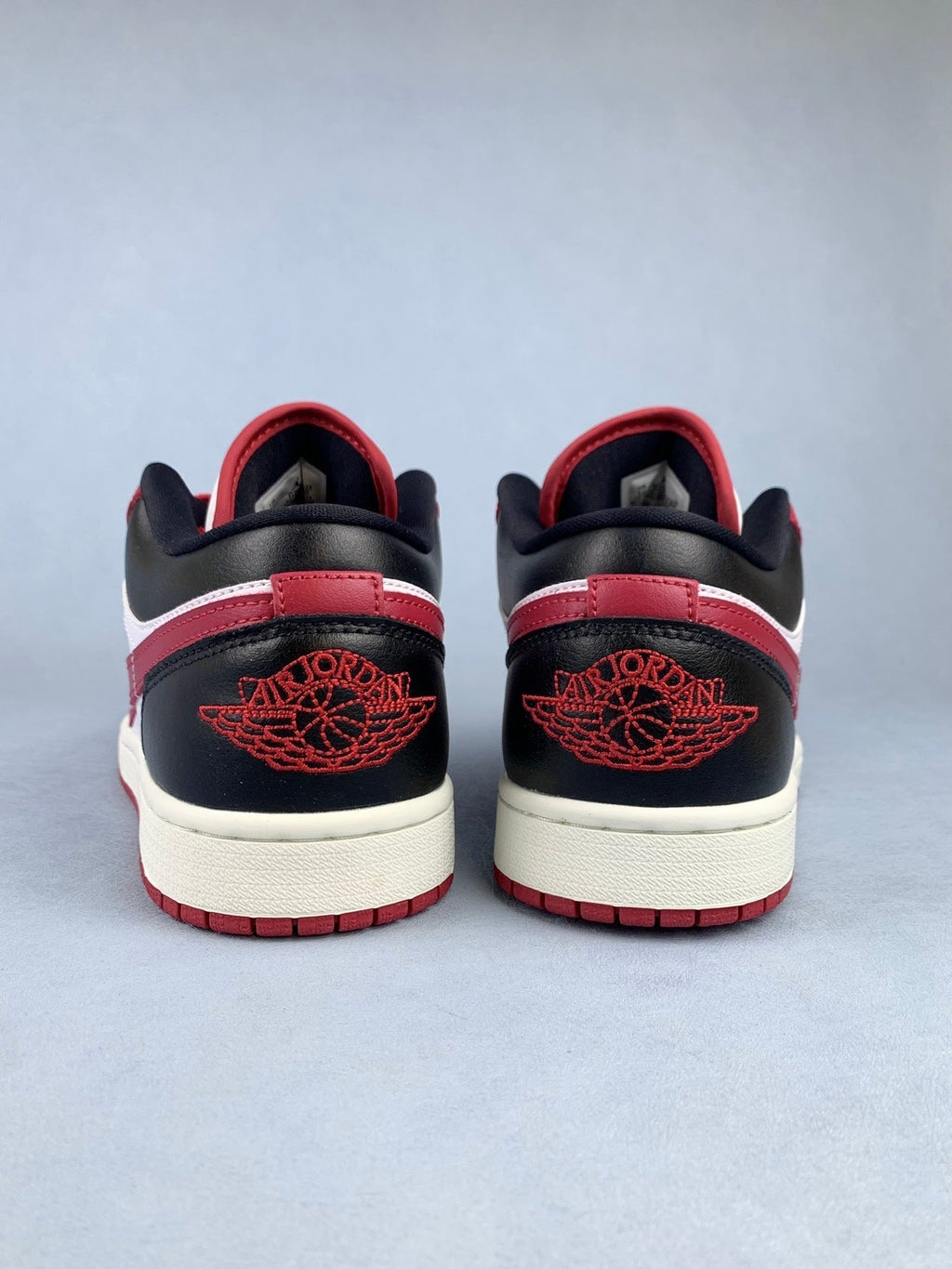Air Jordan 1 Low Black, White, and Red Unisex Sneakers DC0774-160